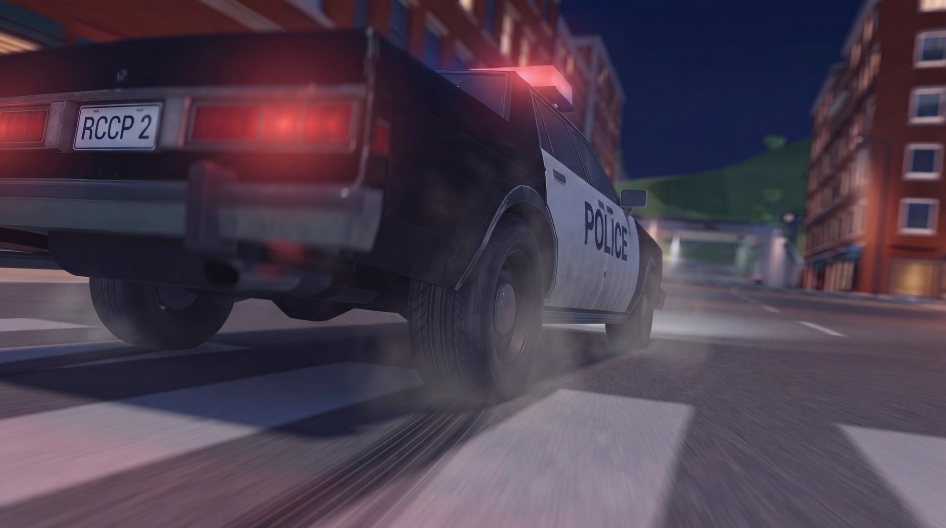 Police car on a city street at night