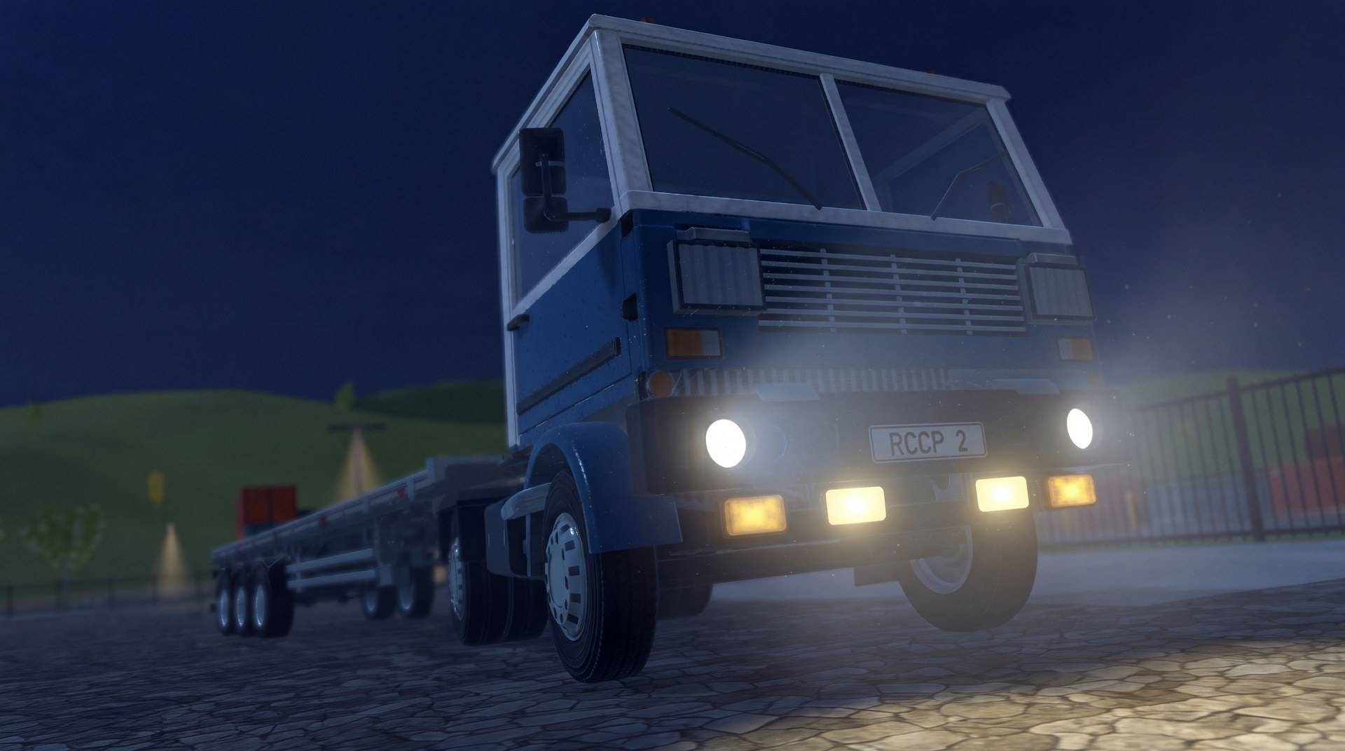 Truck and trailer with headlights on at night